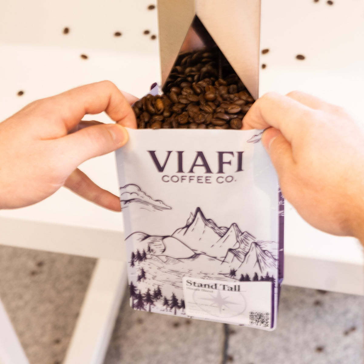 A 12 oz bag of Viafi Stand Tall being filled with whole beans at the roastery