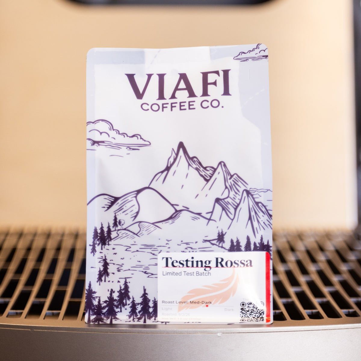 A 12 oz bag of Viafi Testing Rossa standing on the roaster's cooling tray